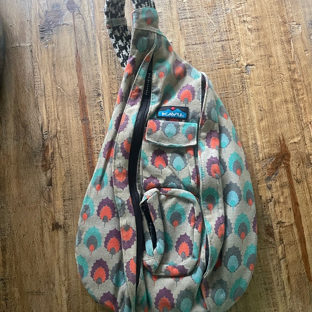 Kavu Women's Sling Bag with Teal and Coral Pattern